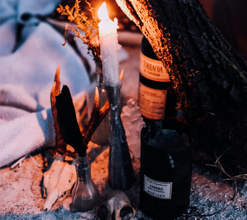 a dark and moody scene, lit buy a candle. The witch is a fascinating figure, one who many women [and men] inspire to be like. It is time to embrace the witch within. It is time to reclaim your personal power and connect with yourself.