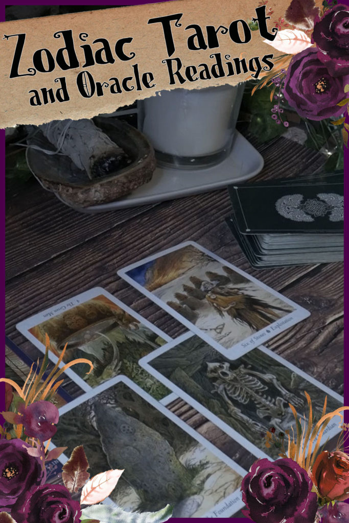 Tarot cards laying on a wooden surface.  Watercolor flowers in shades of purple and red create a border.  Here are the energy prediction zodiac tarot and oracle readings for all zodiac signs for the month of September 2021.